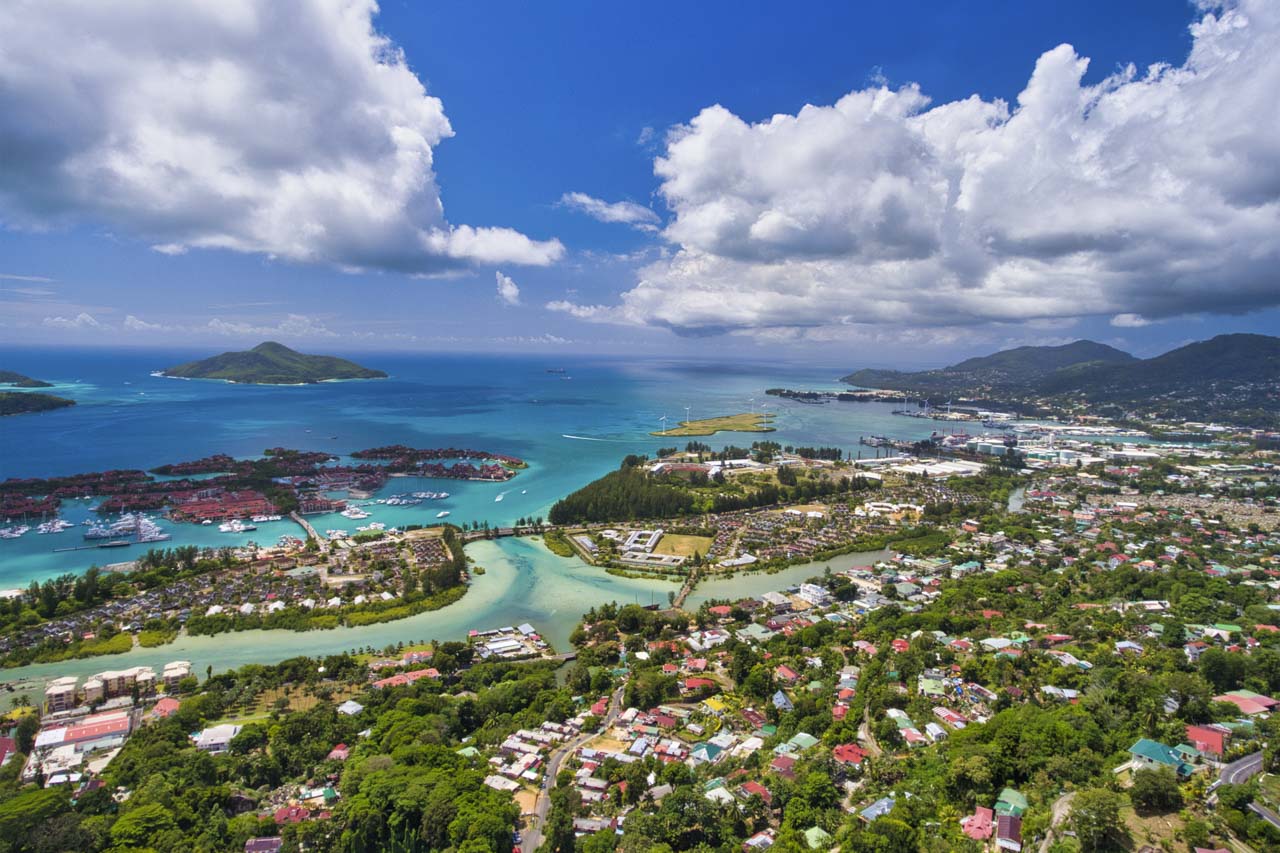 Aerial view of Mahé and Eden Island with yacht marina and surrounding ocean in Seychelles.